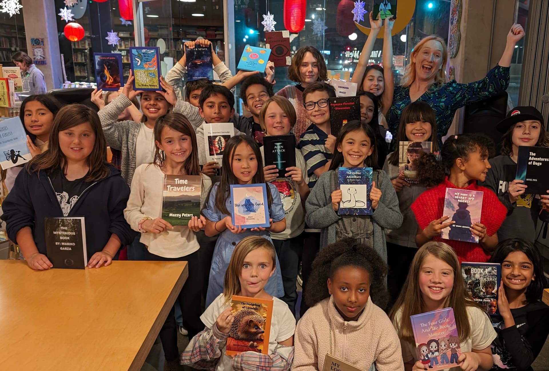 Students celebrating with their published books